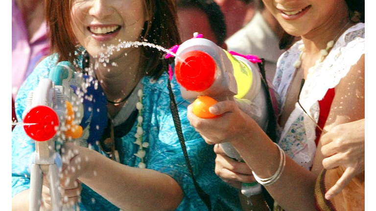 Two Thai woman enjoy to play water battl