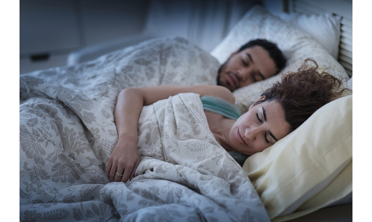 Couple sleeping in bed