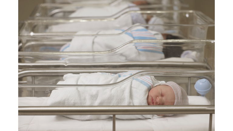 Newborn babies sleeping in hospital nursery