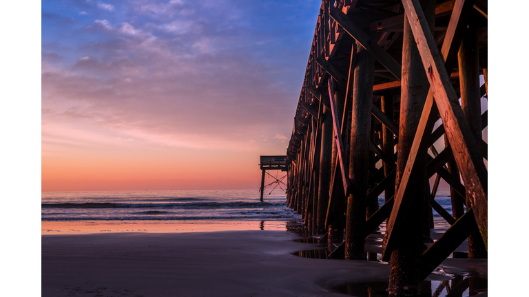 Scenic View Of Beach Against Sky During Sunset