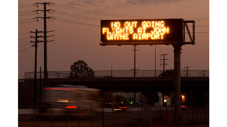 A sign on freeway 55 announces that there are no outgoing flights at John Wayne Airport September 11, 2001 in Santa Ana, California in response to terrorist air attacks on New York and Washington, DC. (Photo by David McNew/Getty Images)