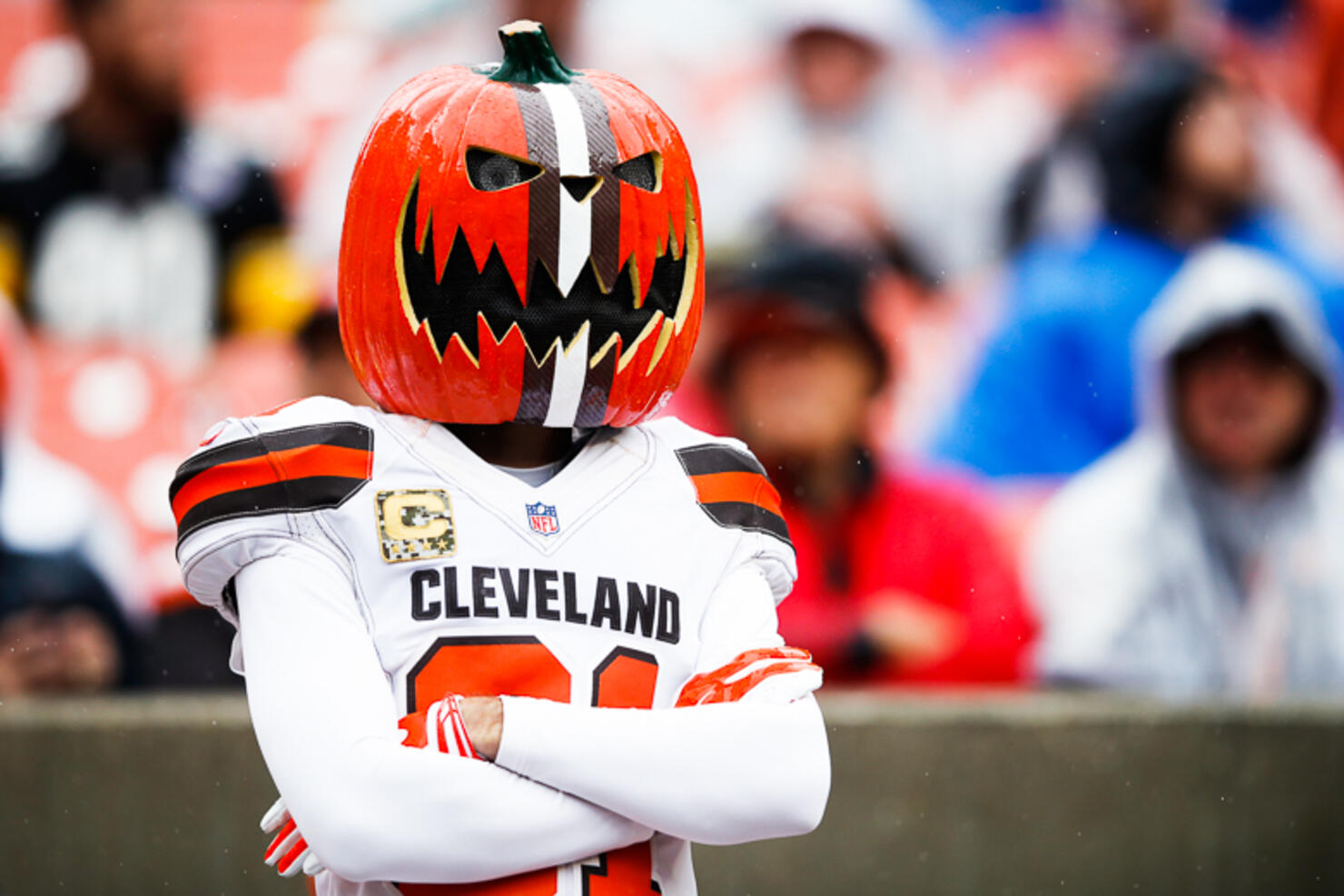 Cleveland Browns fan with a pumpkin head during the Browns game