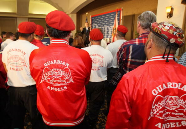 Members of the Guardian Angels, includin
