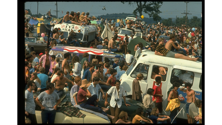 Large crowd of people, incl. people sitting on top