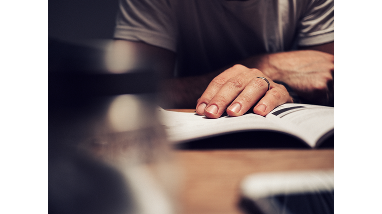 Man reading manual book