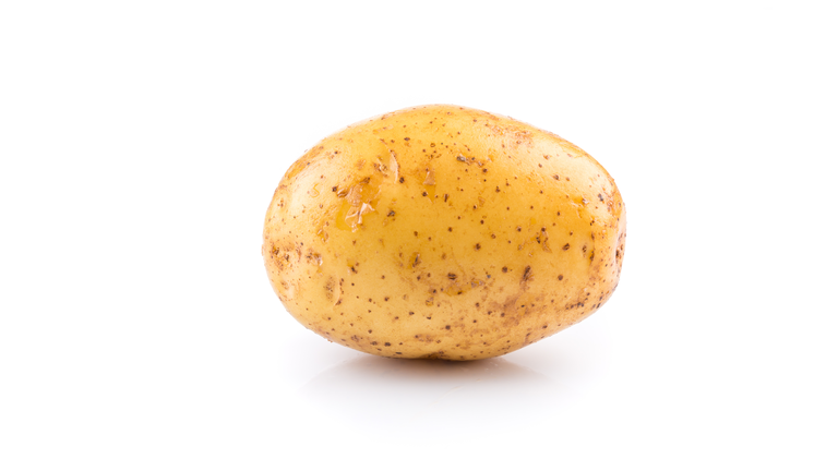 Fresh raw potato on white background