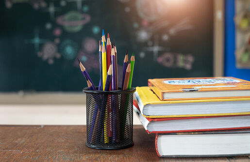 School books on desk, education concept