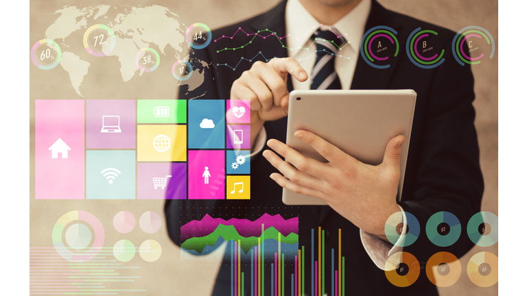 businessman using tablet PC and various business information. paperless office.