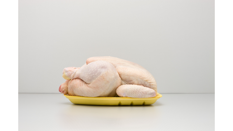 Food concept, raw whole chicken on polystyrene tray
