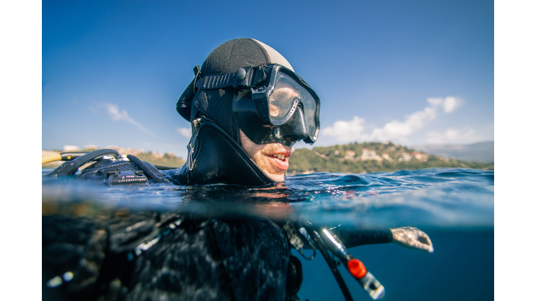 Scuba diver at sea surface