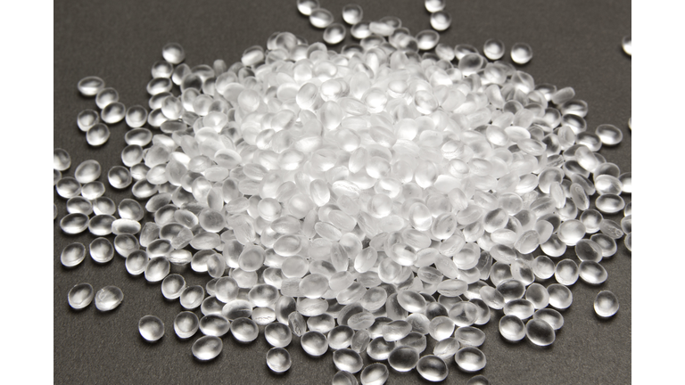 Transparent Polyethylene granules on dark .HDPE Plastic pellets.  Plastic Raw material . IDPE.