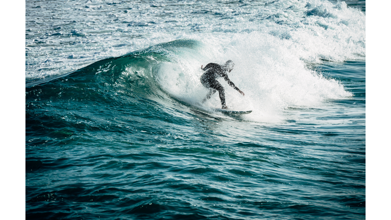 Man Surfing In Sea