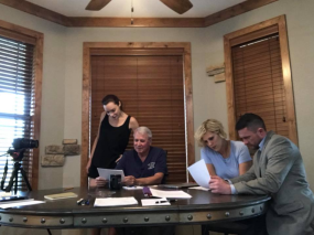 Catherine, Larry, AK, and George meet to discuss the case.