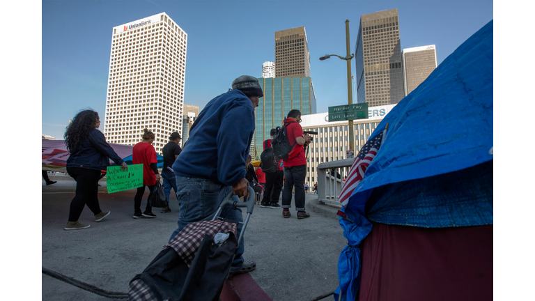 Activists March On International Workers' Day Calling For Immigrant Workers' Rights