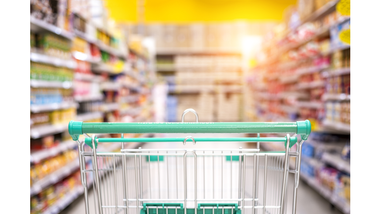 Empty shopping cart in the supermarket shopping mall