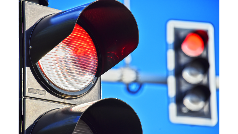 Traffic lights over blue sky