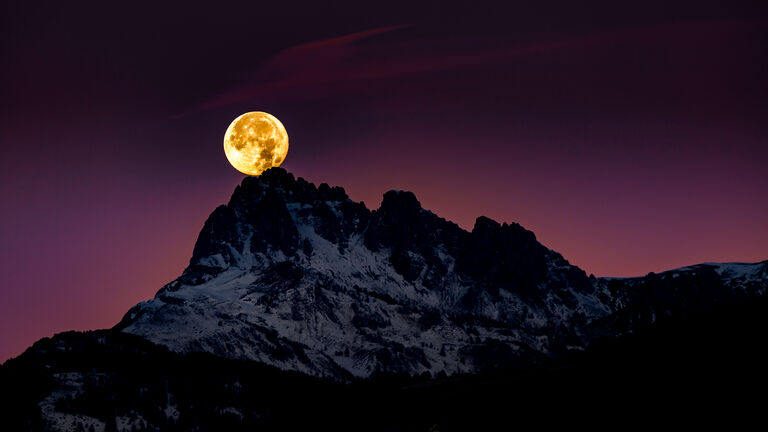Scenic View Of Snowcapped Mountains Against Sky At Night