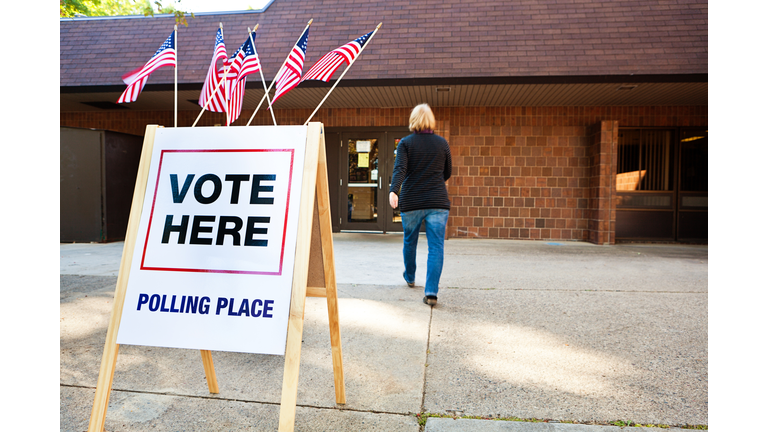 Woman Voter Entering Voting Polling Place for USA Government Election