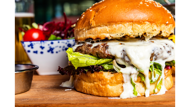 Hamburger with salad and beer