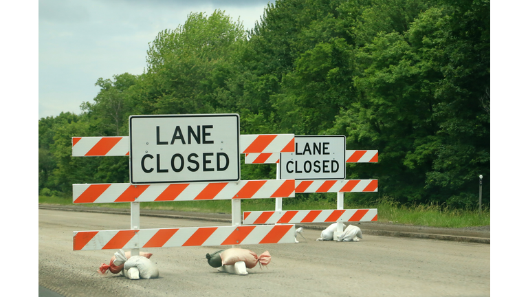 Road closed sign and barricade on a highway