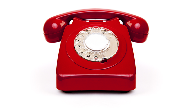 A red vintage old school telephone