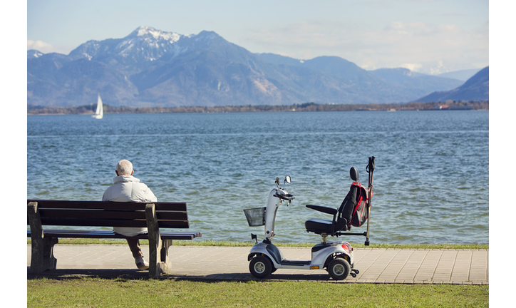 Senior man in wheelchair outdoors