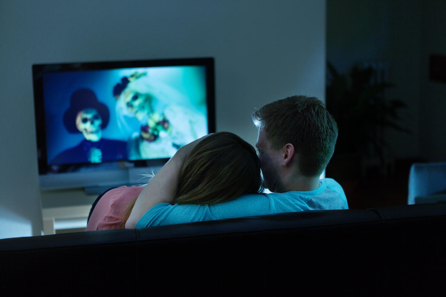 Couple Watching Scary Halloween Movie Together on TV