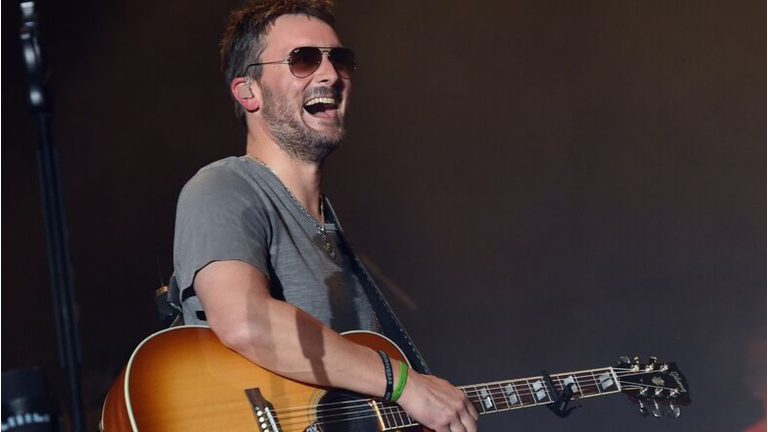 Eric Church Sees Little Girl's Sign, Donates $10,000 To Her School