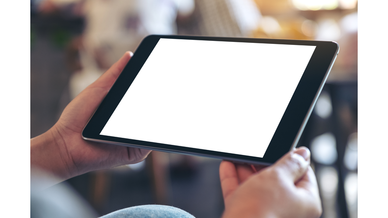 Cropped Hands Of Woman Holding Digital Tablet