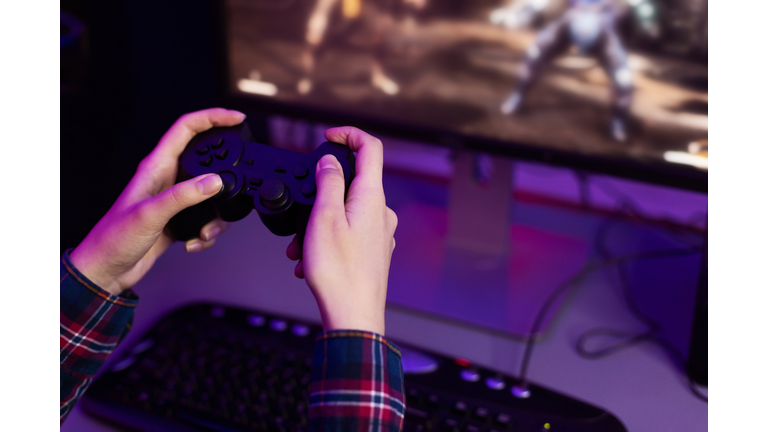 Gamer playing video game, holding joystick, free space