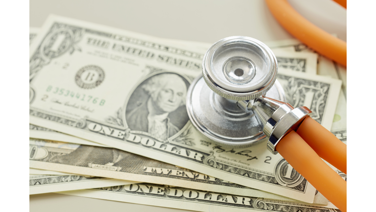 Close-up of American Dollar banknotes with stethoscope