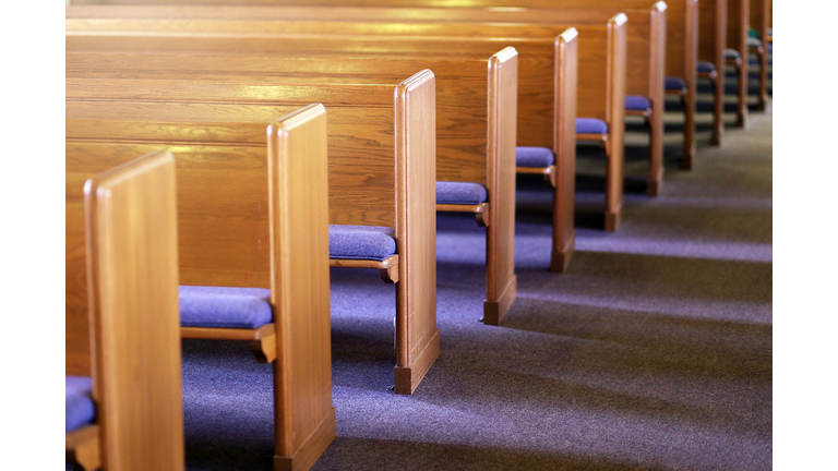 Rows of Church Pews in an Empty Church Sanctuary
