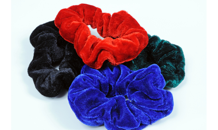 Four velvet hair scrunchies.