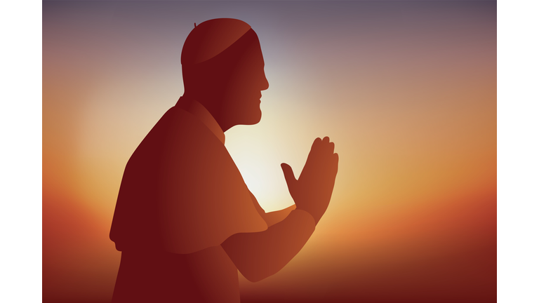 Concept of prayer for Christians with a priest who holds hands clasped.