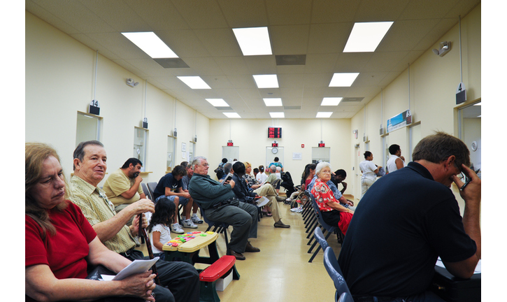 Customers que in DMV waiting room