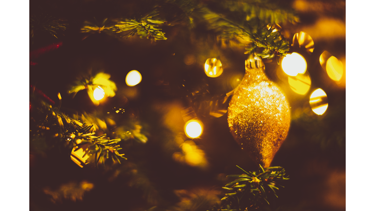 Glowing Ornate and String Light on a Christmas Tree