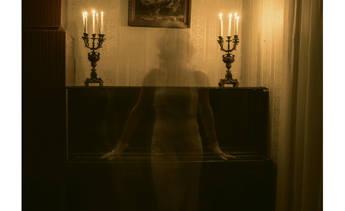 Female Ghost Against Piano In Darkroom