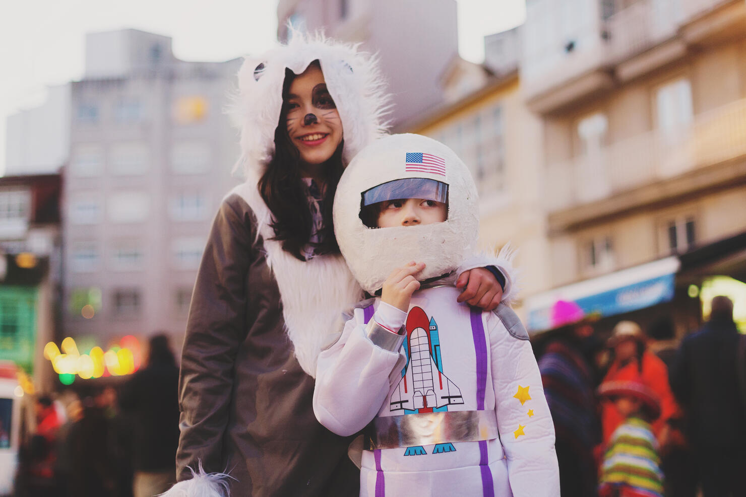 two kids dressed up in halloween  costumes.Astronaut and wolf