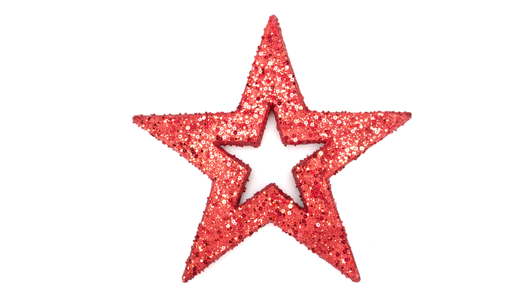 A red glitter star isolated on white background