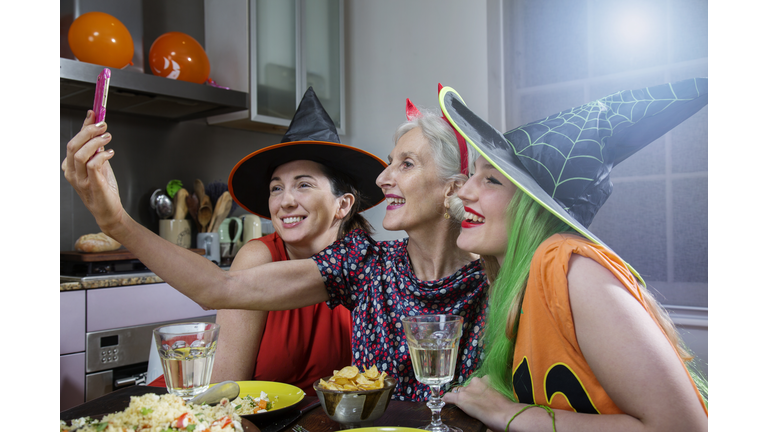 Women Pose for Selfie, dressed up for Halloween.