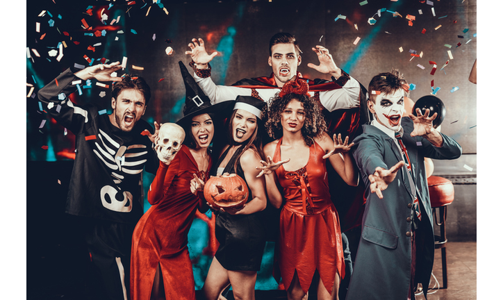 Portrait of Young Smiling People in Scary Costumes