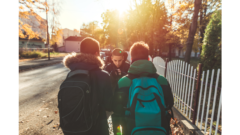 Way to school. Two angry teenage boys