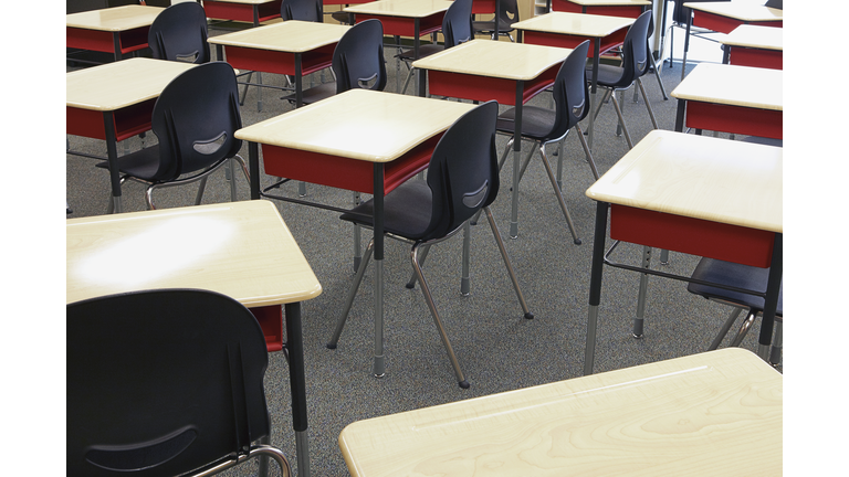 Desks and chairs in empty classroom