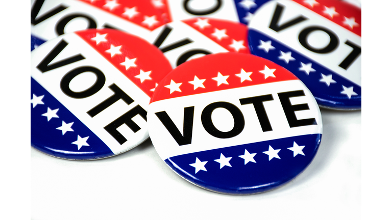 close up of campaign voting flag pins on white