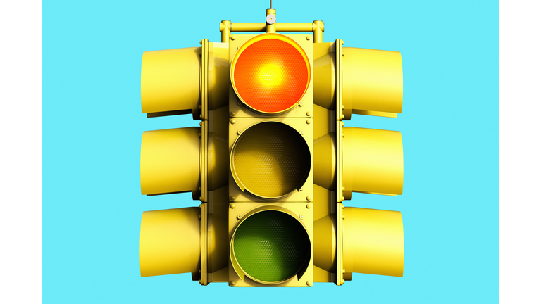 Low Angle View Of Road Signal Against Blue Sky