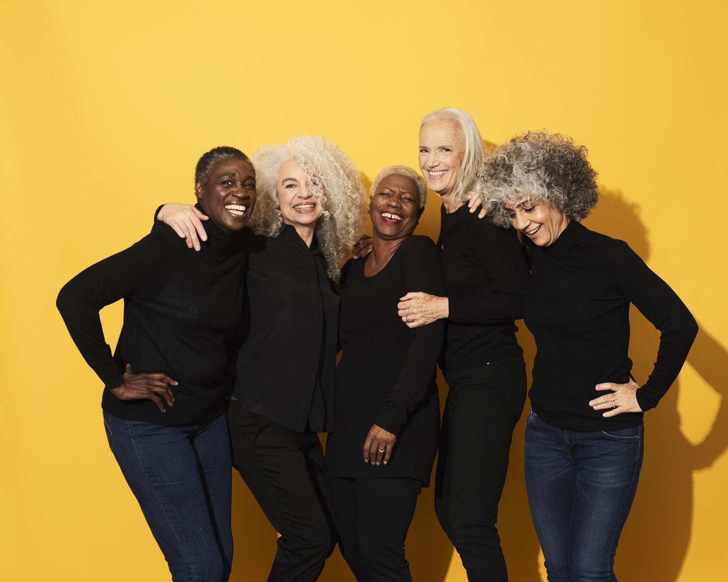 Portrait of five women laughing and having fun