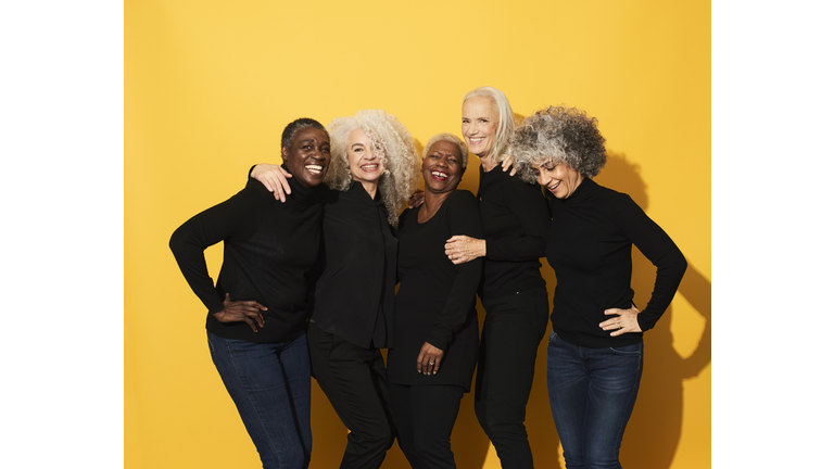 Portrait of five women laughing and having fun