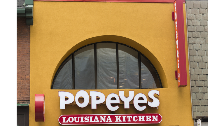 Signage of Popeyes Louisiana Kitchen on a yellow background