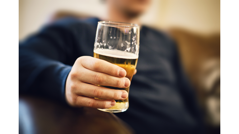 Man drinking pint of beer