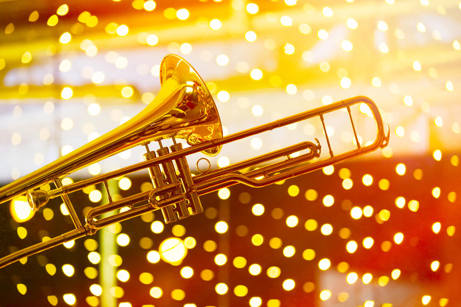 Trumpet in musical lights abstract background